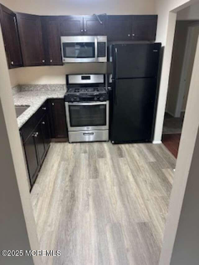 702 Goldthread Court Jackson, NJ 08527 - Photo 13 of 20 a kitchen with a sink stainless steel appliances and cabinets