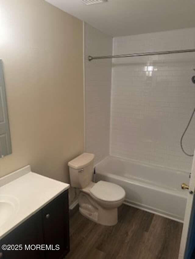702 Goldthread Court Jackson, NJ 08527 - Photo 19 of 20 a white toilet sitting next to a bath tub