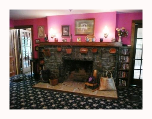 1414 State Rt 30 Clinton, PA 15026 - Photo 6 of 15 Living Room. Handsome custom hearth in the large lovely living room. There is also a Soapstone wood stove included to keep you nice and toasty during the winter months.