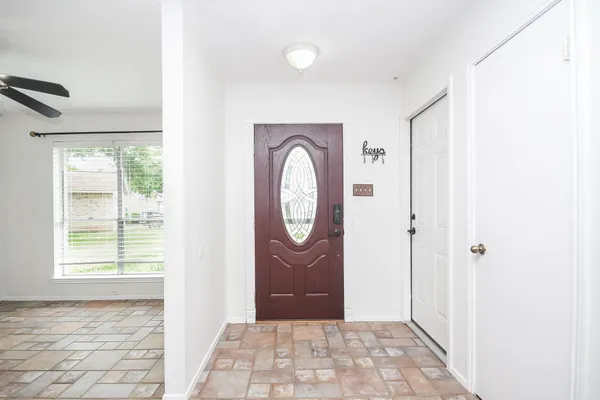 a view of an entryway with wooden floor