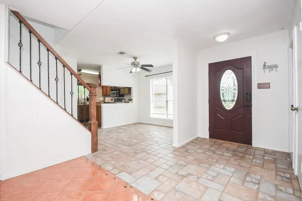 a view of an entryway with wooden floor