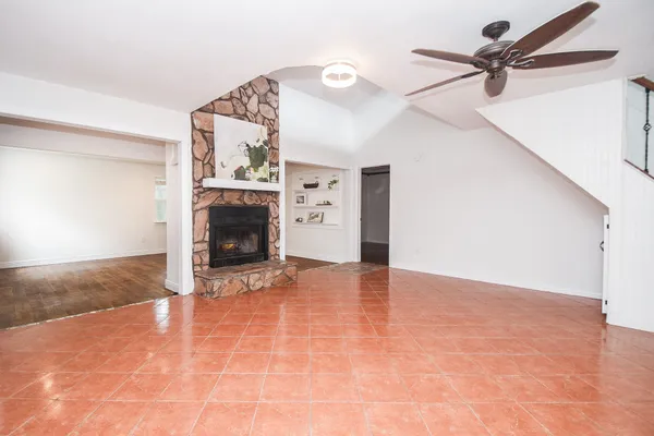a view of an empty room with a fireplace