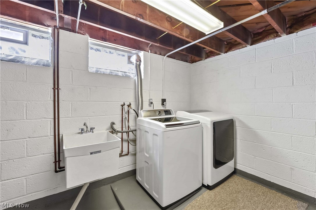 21483 Eaton Road Cleveland, OH 44126 - Photo 25 of 25 Clothes washing area featuring electric dryer hookup, sink, and washing machine and dryer