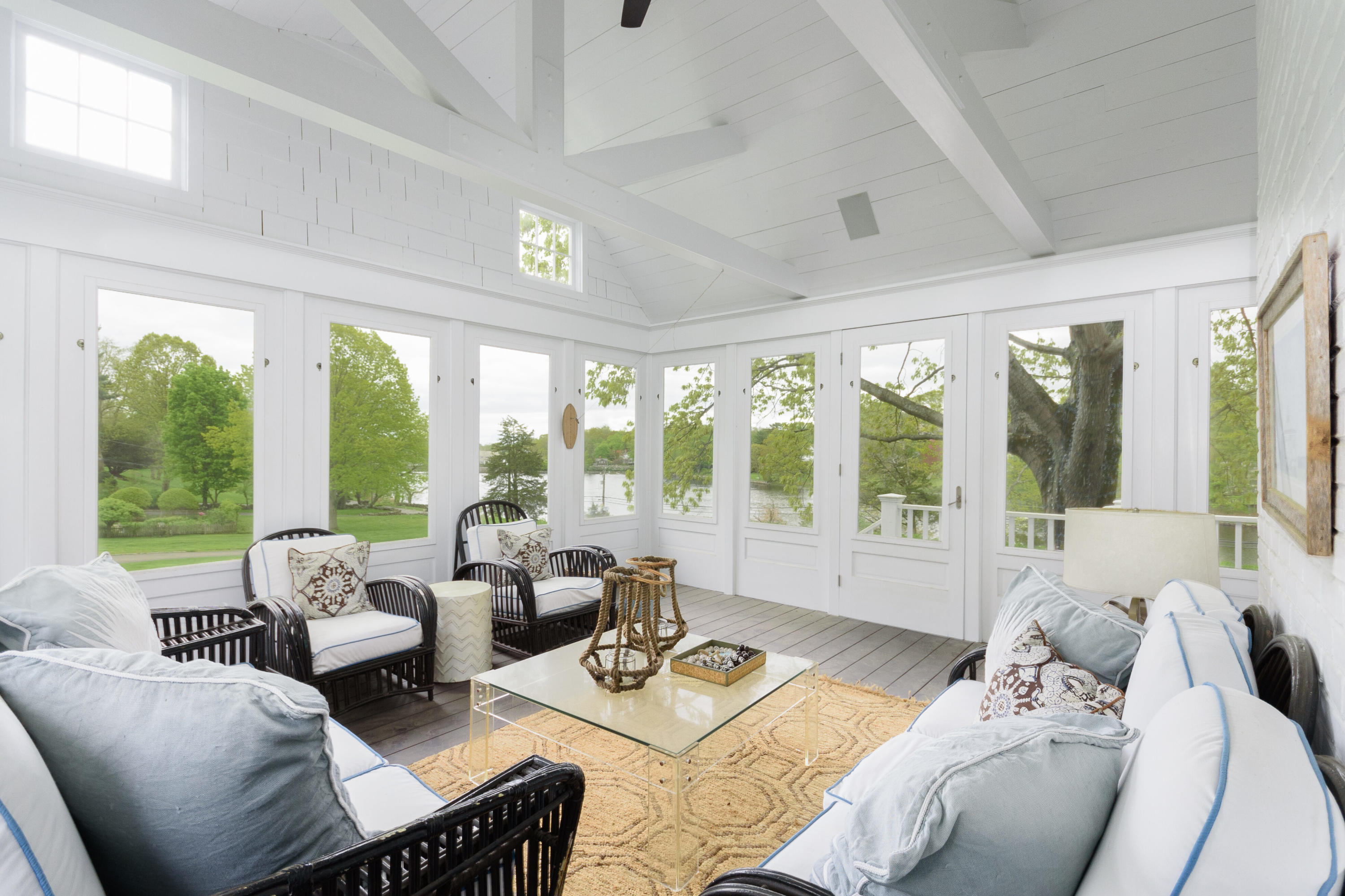 118 Goodwives River Road Darien, CT 06820 - Photo 22 of 68 a living room with furniture and floor to ceiling windows