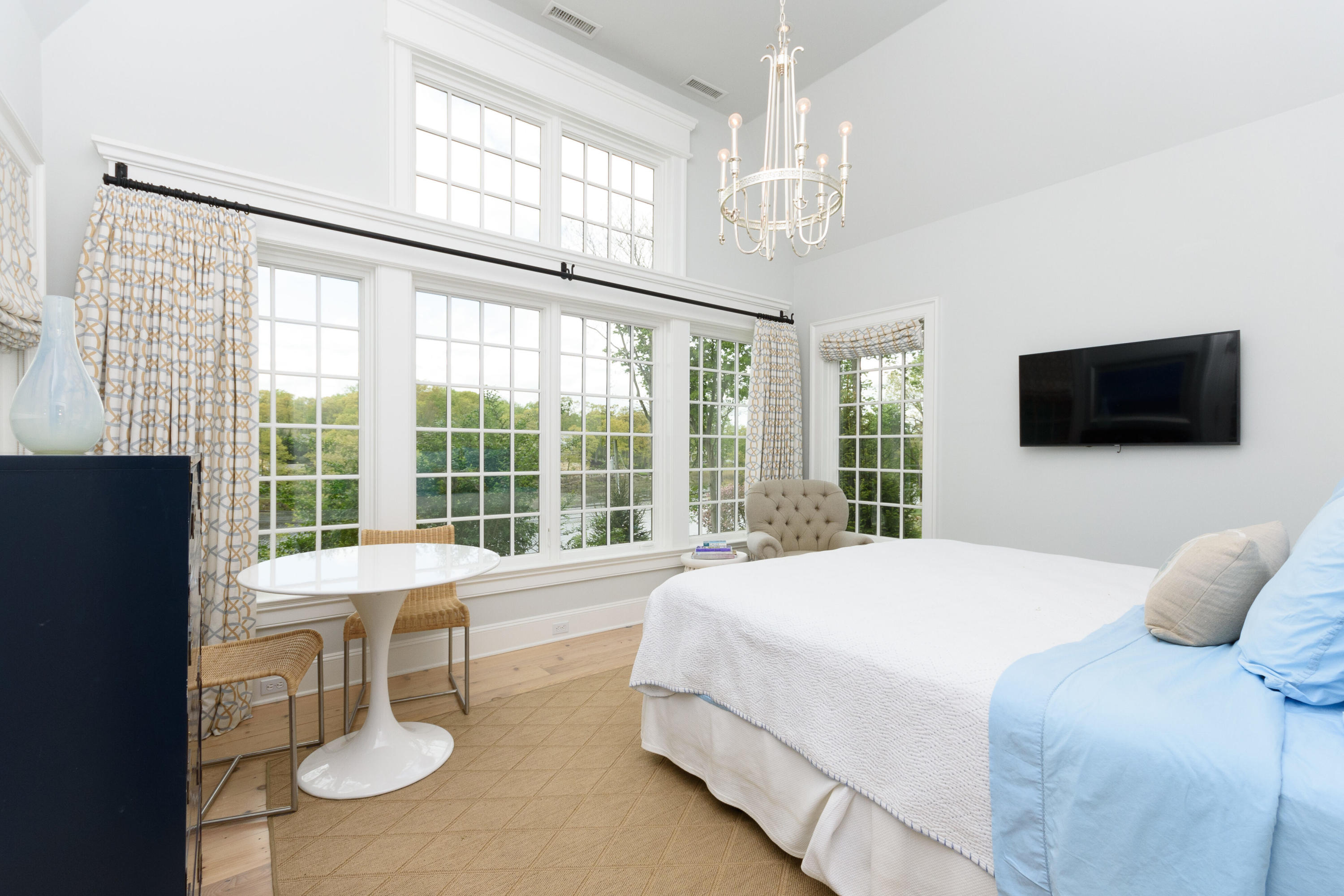 118 Goodwives River Road Darien, CT 06820 - Photo 29 of 68 a spacious bedroom with a bed and a large window