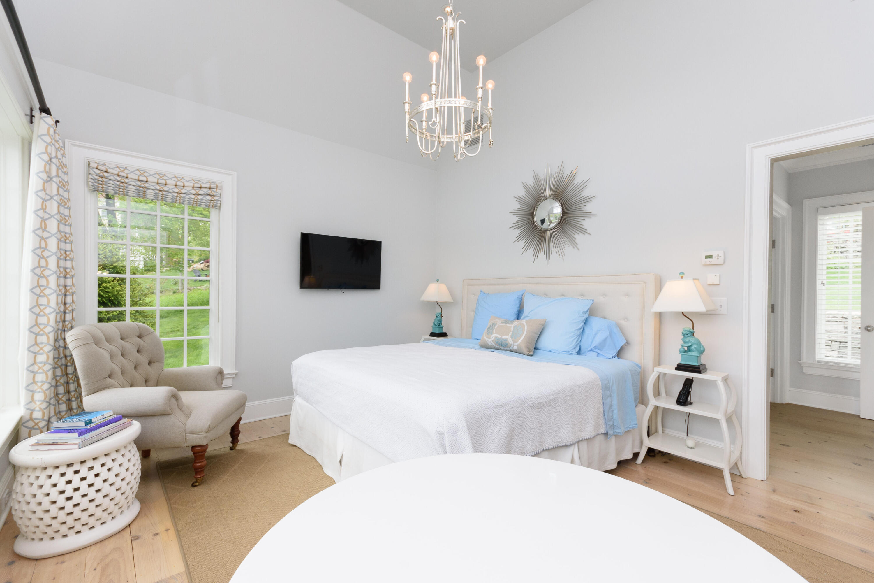 118 Goodwives River Road Darien, CT 06820 - Photo 30 of 68 a bedroom with two beds and a chandelier