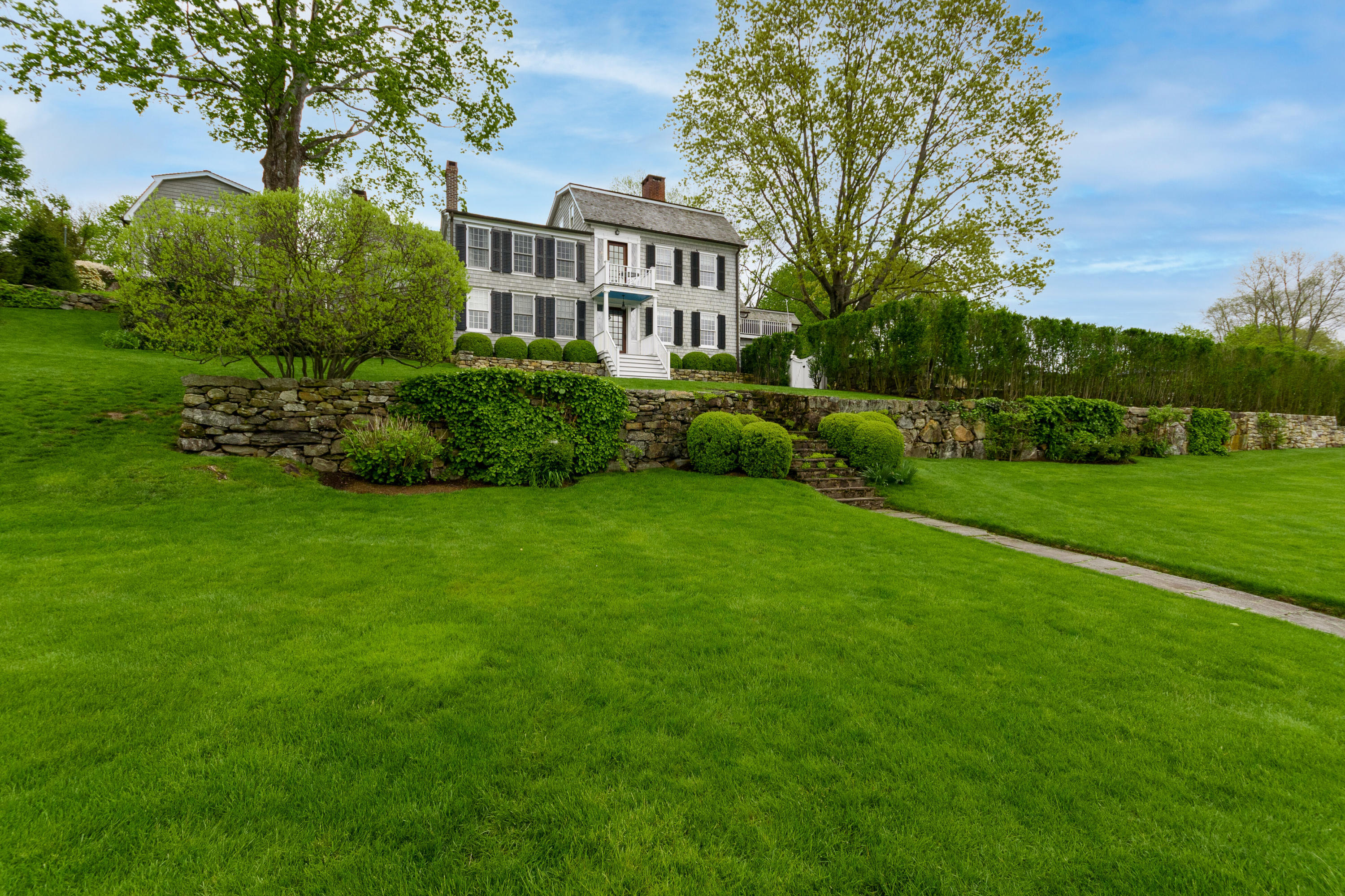 118 Goodwives River Road Darien, CT 06820 - Photo 4 of 68 a view of a front of residential houses with yard and green space