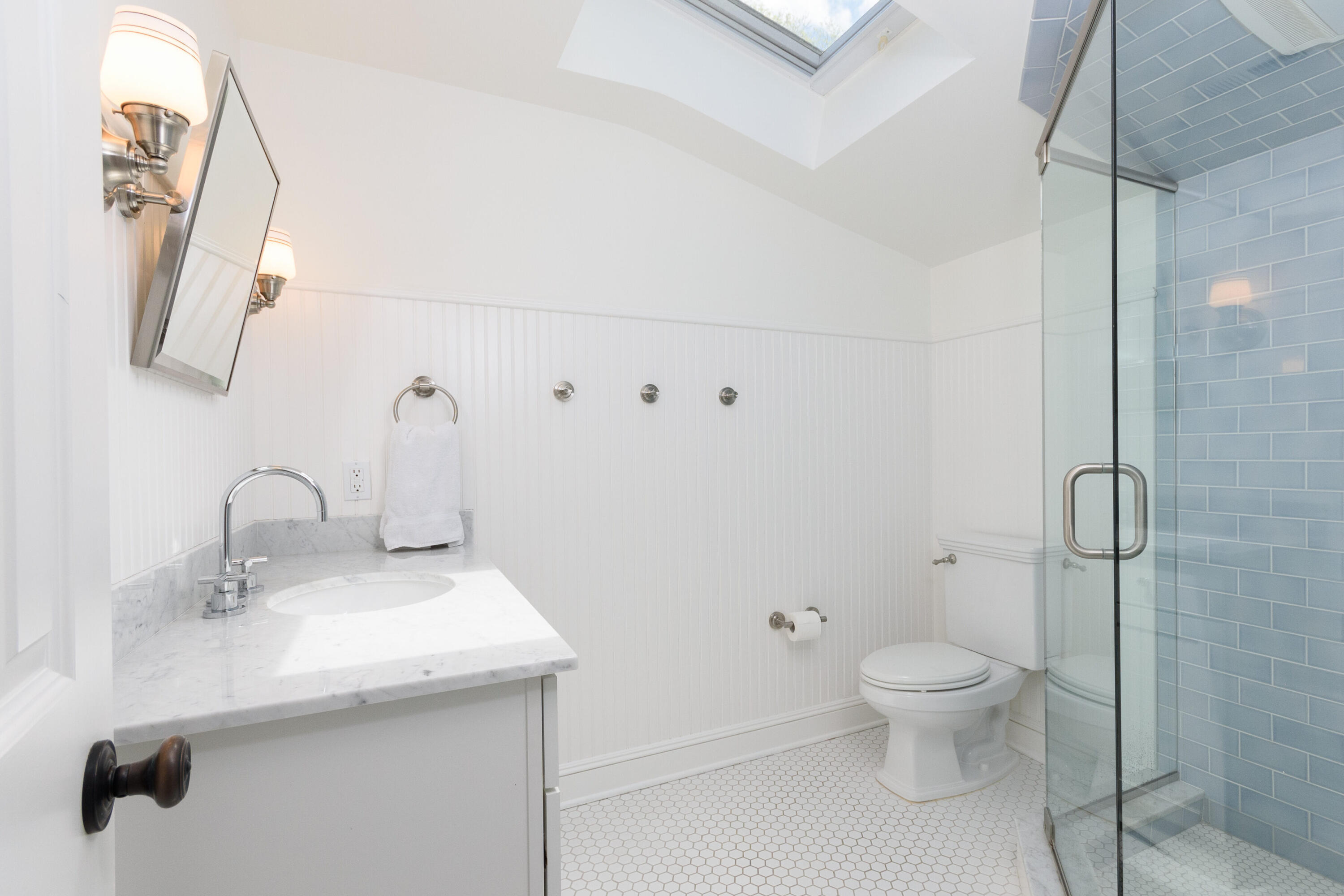 118 Goodwives River Road Darien, CT 06820 - Photo 38 of 68 a bathroom with a sink a toilet and shower