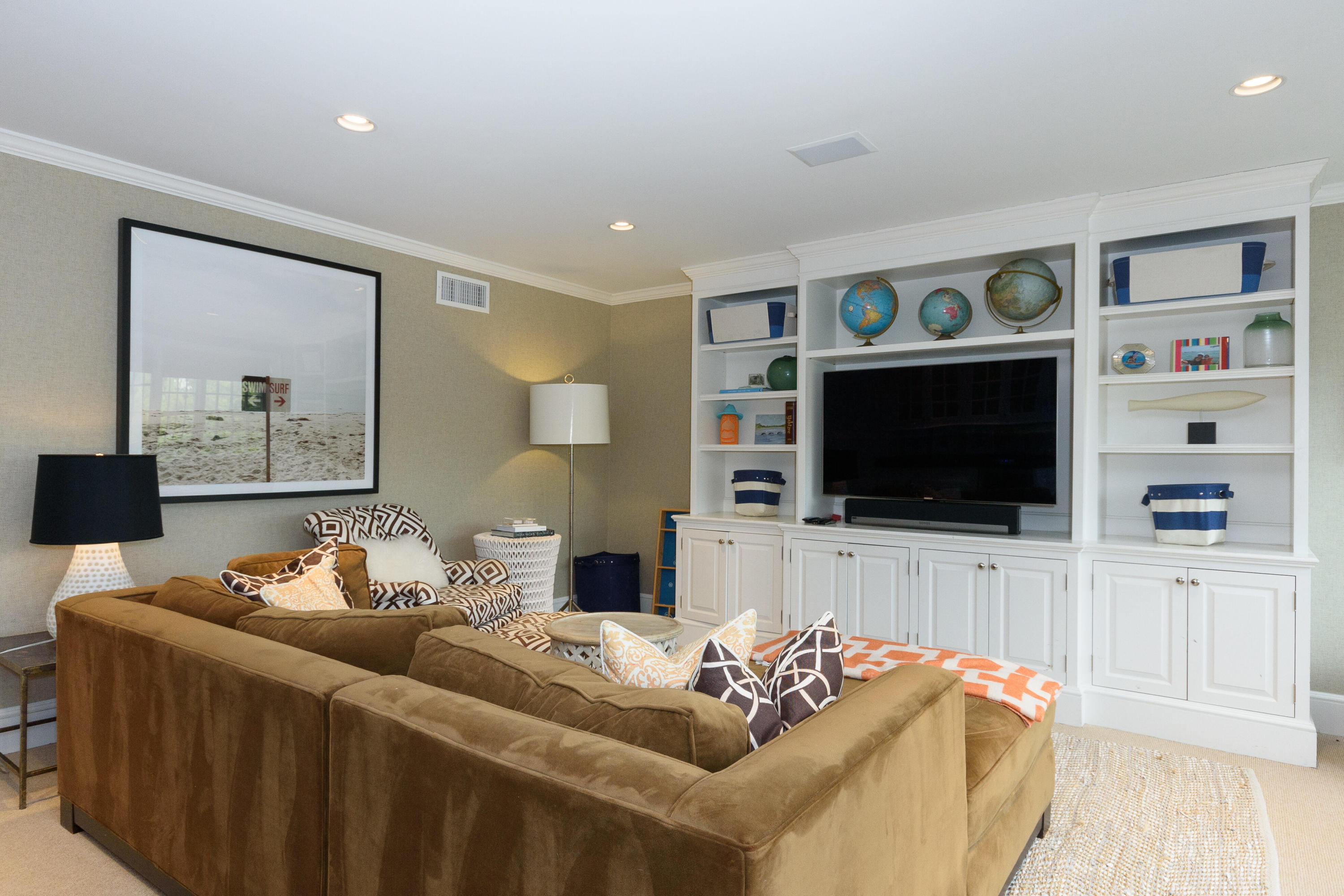 118 Goodwives River Road Darien, CT 06820 - Photo 44 of 68 a living room with furniture and a flat screen tv