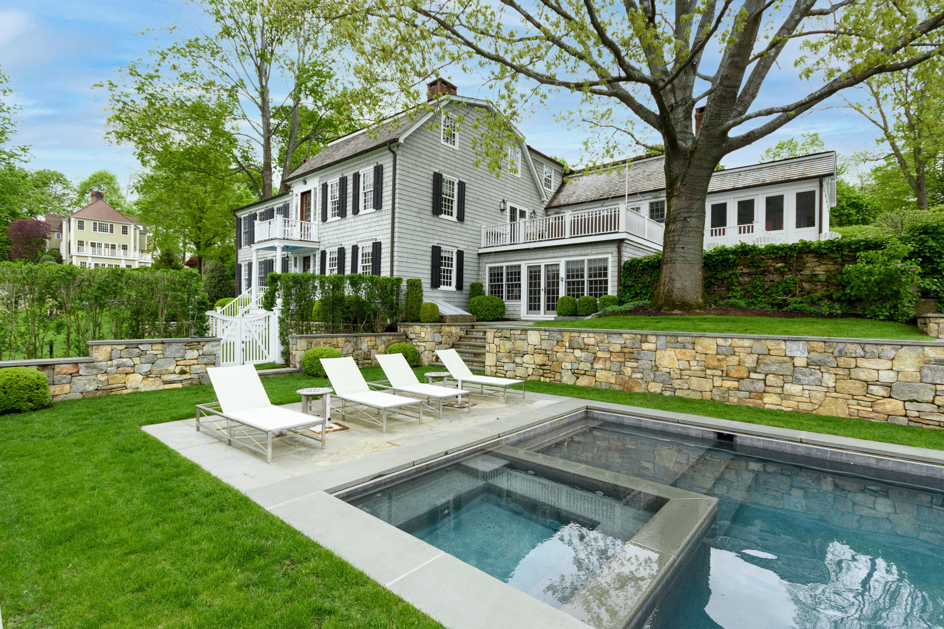 118 Goodwives River Road Darien, CT 06820 - Photo 50 of 68 a view of a house with swimming pool and a yard