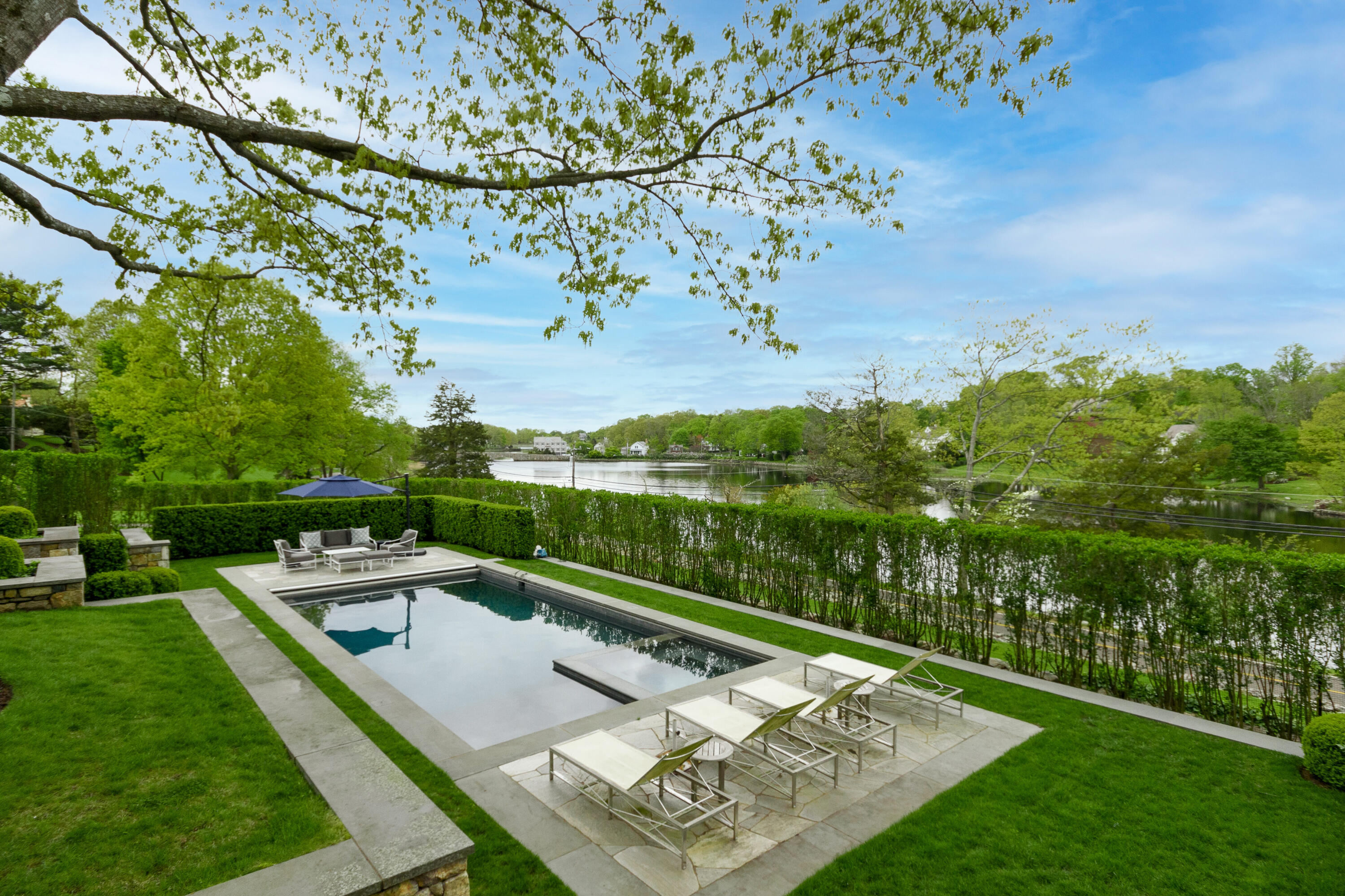 118 Goodwives River Road Darien, CT 06820 - Photo 51 of 68 an aerial view of a house with a garden