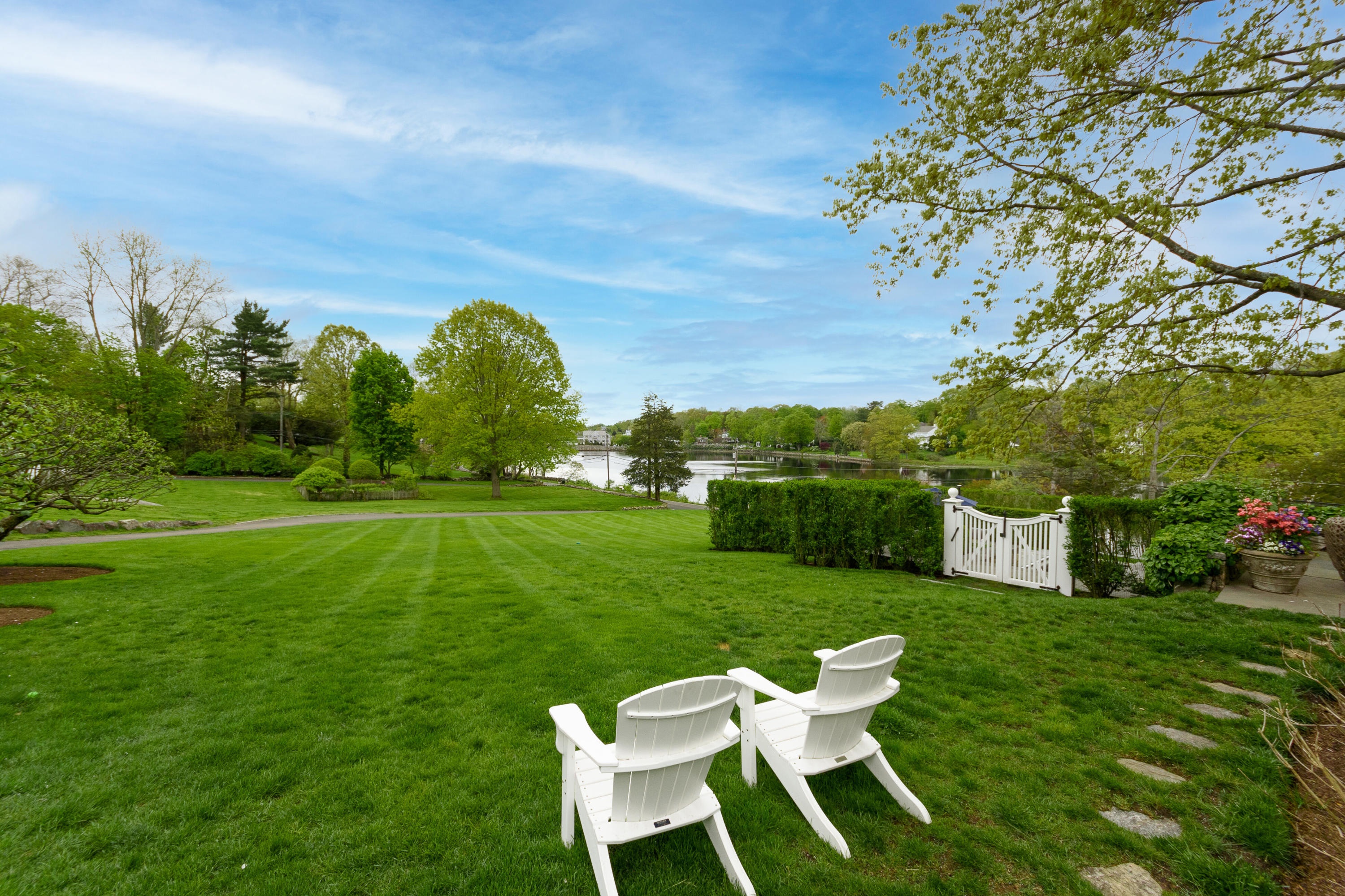 118 Goodwives River Road Darien, CT 06820 - Photo 54 of 68 a view of a chair and table on the green field