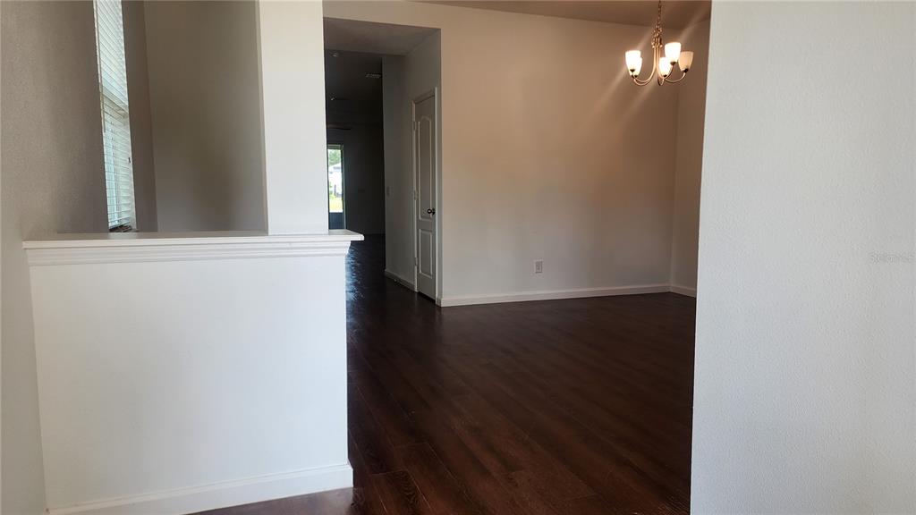 3230 Stratton Circle Kissimmee, FL 34744 - Photo 7 of 28 a view of a hallway with wooden floor
