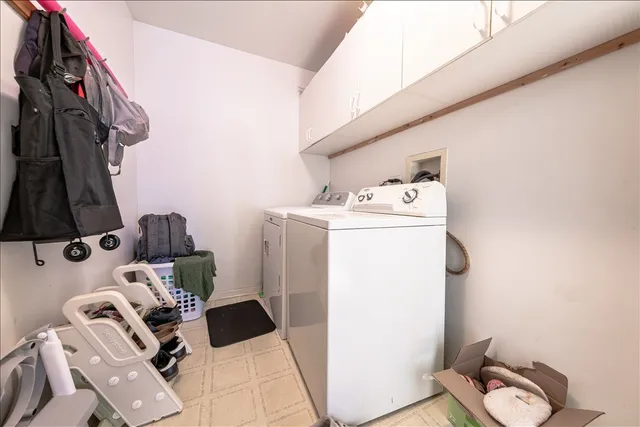 a view of storage and utility room with washer and dryer