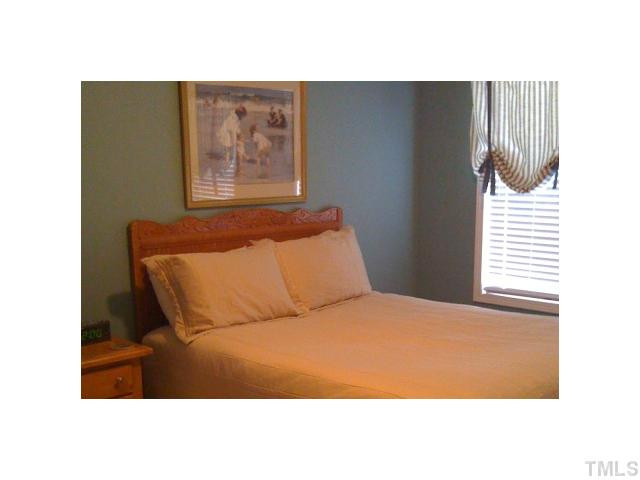 8620 Royton Circle Raleigh, NC 27613 - Photo 23 of 25 Another guest room and the 4th bedroom opens to it's own private 2nd floor deck. Great for that morning coffe & paper. Bedroom