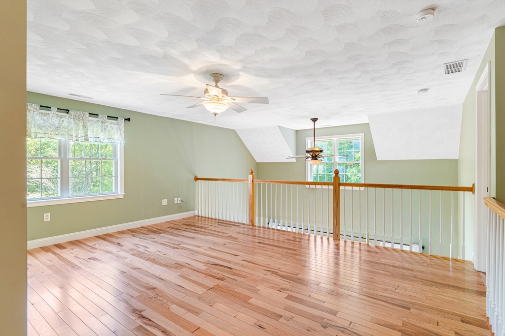 53 Baldwin Road, Unit 1201 Billerica, MA 01821 - Photo 21 of 36 a view of a room with wooden floor and window