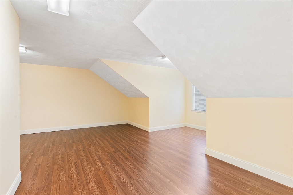 53 Baldwin Road, Unit 1201 Billerica, MA 01821 - Photo 29 of 36 a view of an empty room with wooden floor