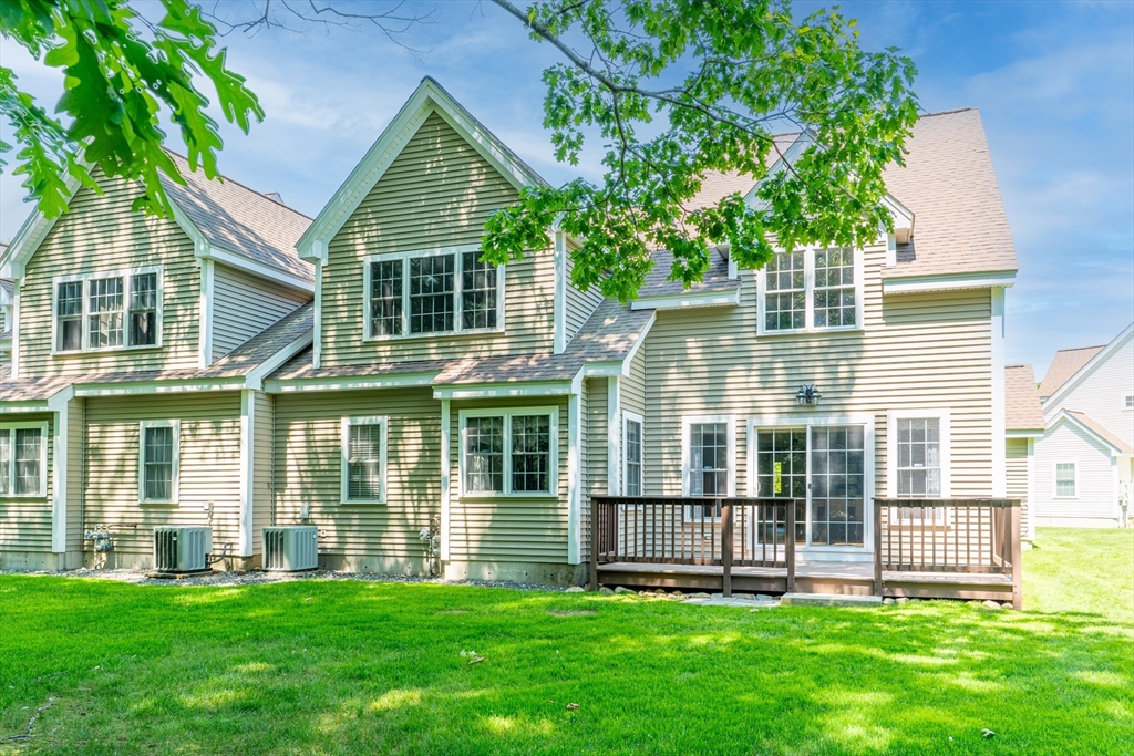 53 Baldwin Road, Unit 1201 Billerica, MA 01821 - Photo 34 of 36 front view of a house with a yard