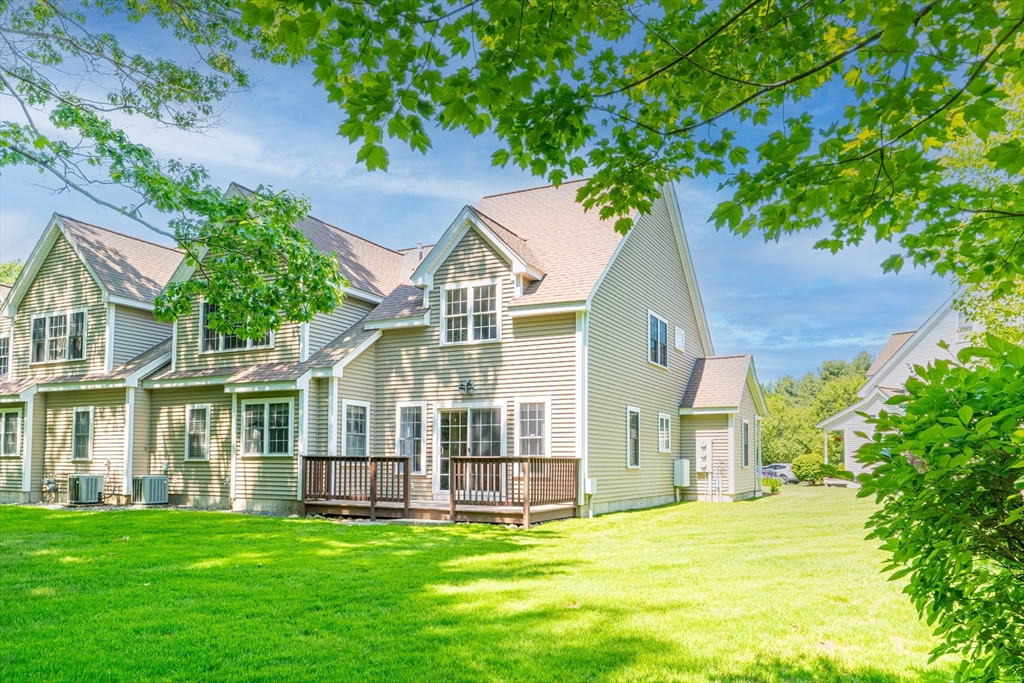 53 Baldwin Road, Unit 1201 Billerica, MA 01821 - Photo 35 of 36 front view of a house with a yard