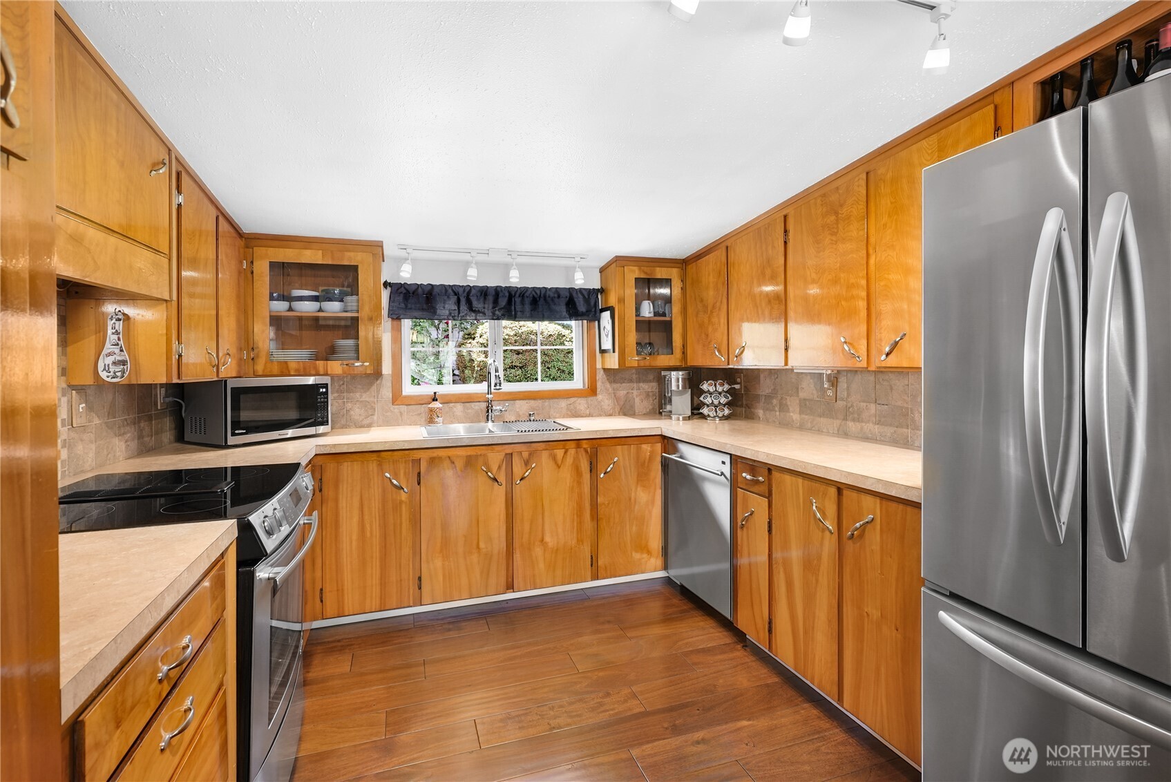 29 Northwest Lake Roesiger Road Snohomish, WA 98290 - Photo 12 of 38 a kitchen with stainless steel appliances granite countertop a refrigerator a sink dishwasher stove top oven and cabinets