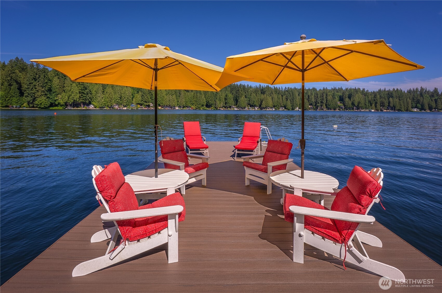 29 Northwest Lake Roesiger Road Snohomish, WA 98290 - Photo 23 of 38 an outdoor sitting area with couch and table under an umbrella
