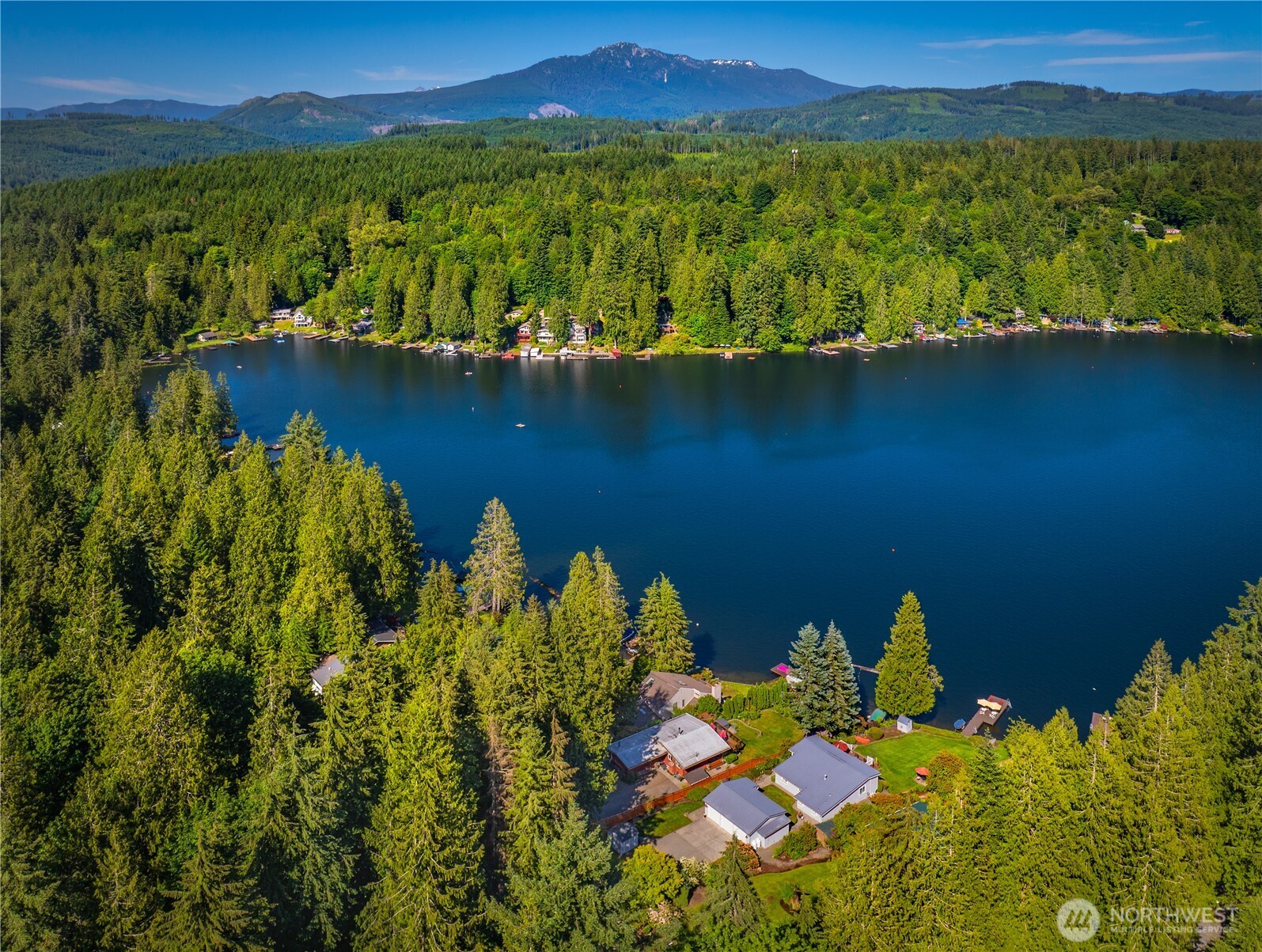 29 Northwest Lake Roesiger Road Snohomish, WA 98290 - Photo 25 of 38 a view of a lake with a mountain in the background