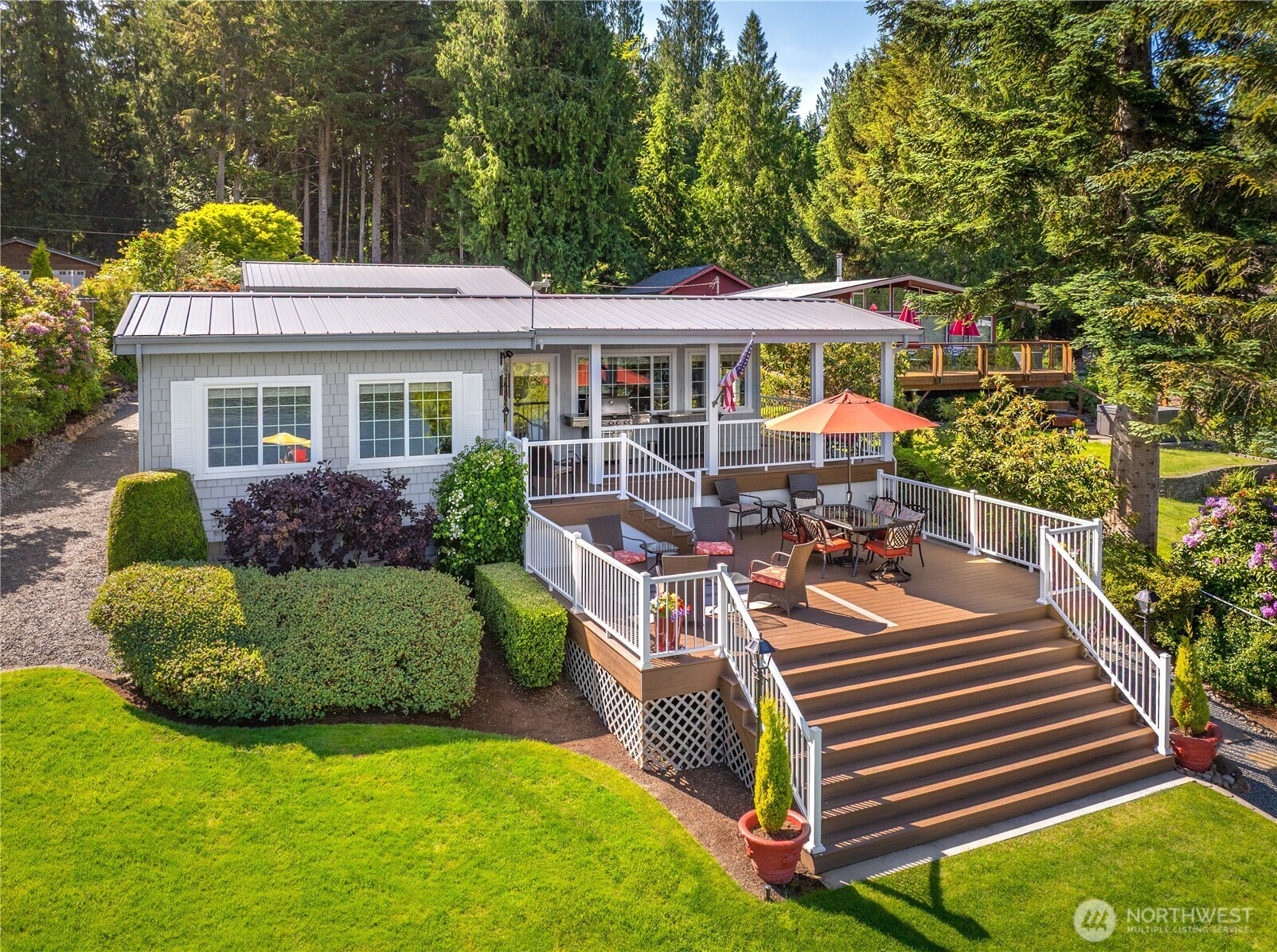 29 Northwest Lake Roesiger Road Snohomish, WA 98290 - Photo 27 of 38 a view of a house with backyard and sitting area