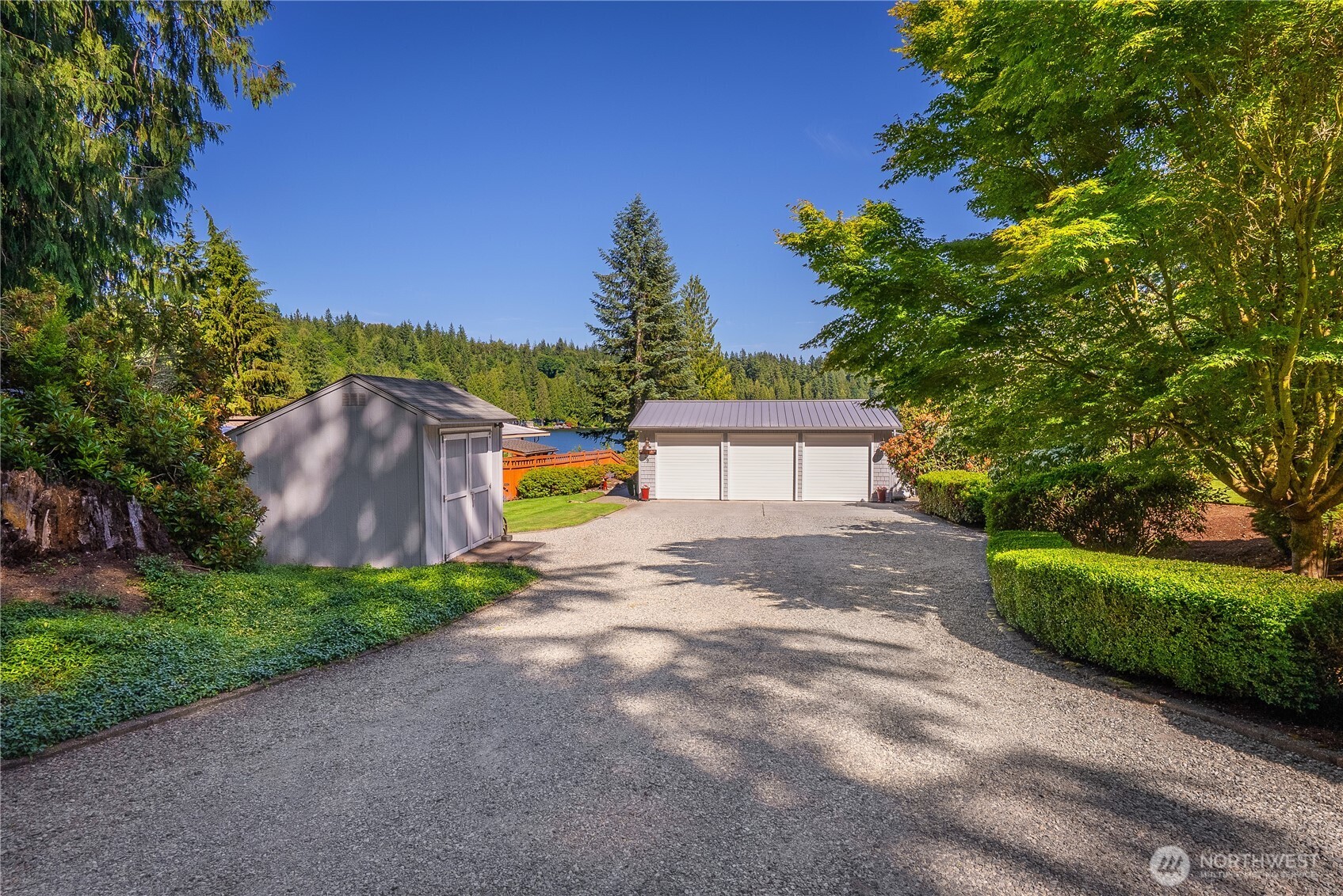 29 Northwest Lake Roesiger Road Snohomish, WA 98290 - Photo 28 of 38 a view of a yard with plants and a bench