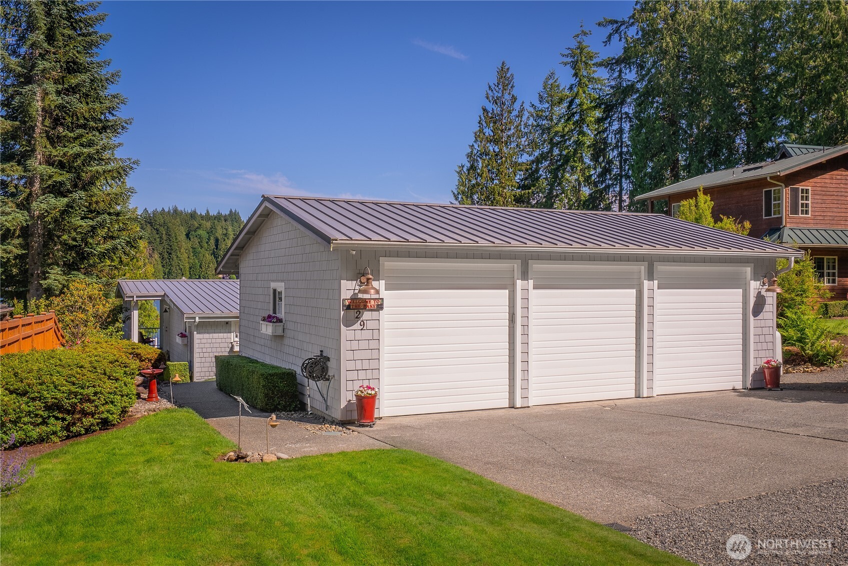 29 Northwest Lake Roesiger Road Snohomish, WA 98290 - Photo 29 of 38 a front view of a house with a yard and garage