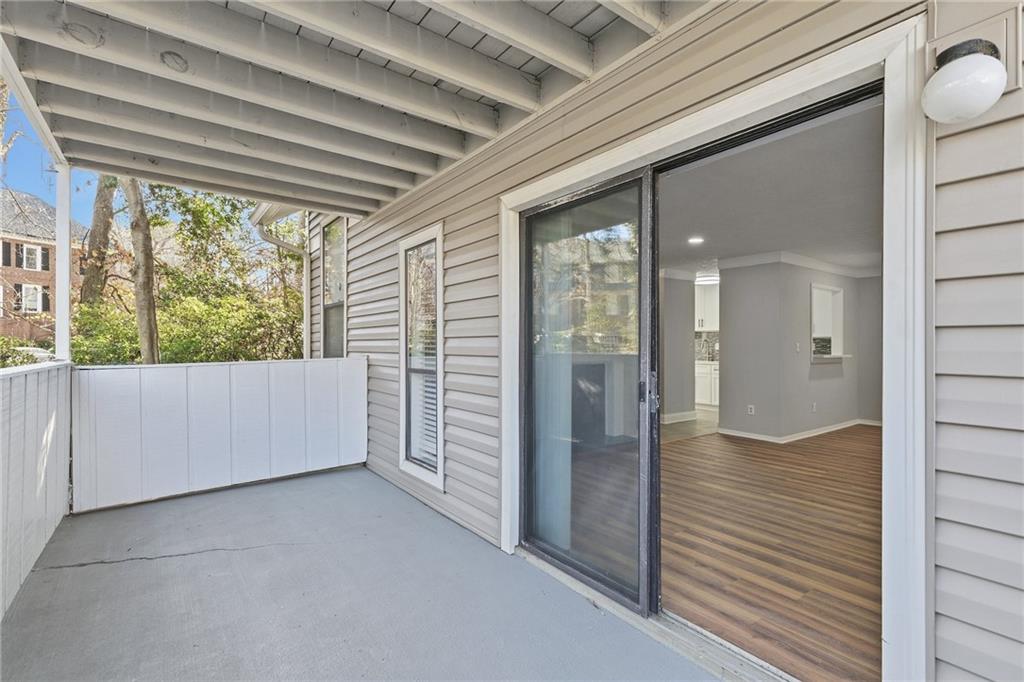601 Wynnes Ridge Circle Southeast Marietta, GA 30067 - Photo 11 of 28 a view of empty room with wooden floor and fan