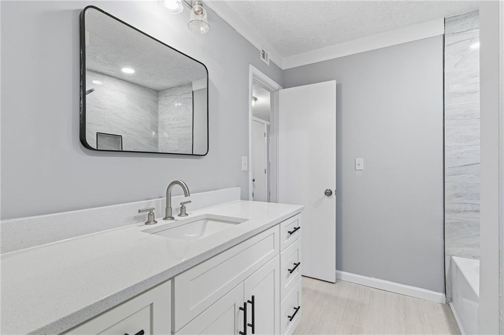601 Wynnes Ridge Circle Southeast Marietta, GA 30067 - Photo 20 of 28 a bathroom with a sink and a mirror