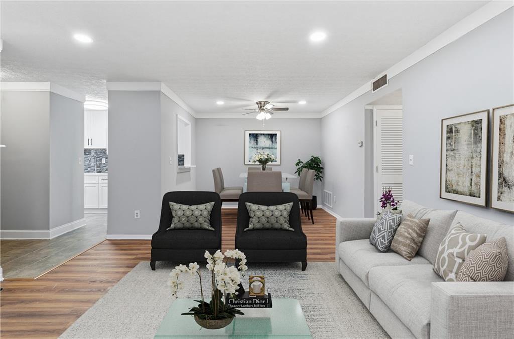 601 Wynnes Ridge Circle Southeast Marietta, GA 30067 - Photo 7 of 28 a living room with furniture and wooden floor