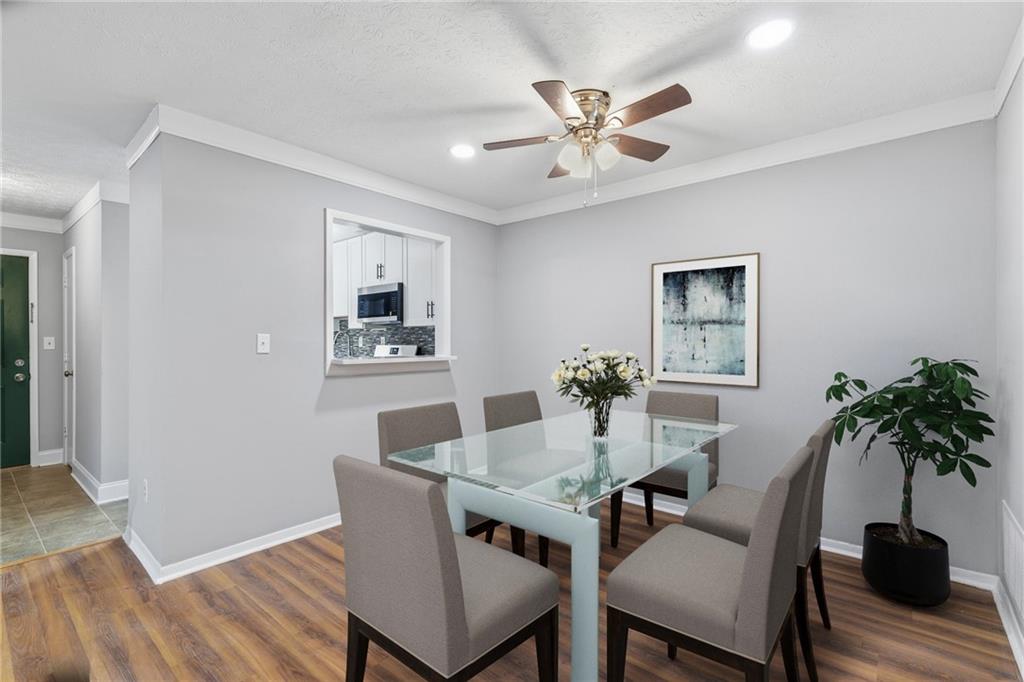 601 Wynnes Ridge Circle Southeast Marietta, GA 30067 - Photo 9 of 28 a dining room with furniture and window