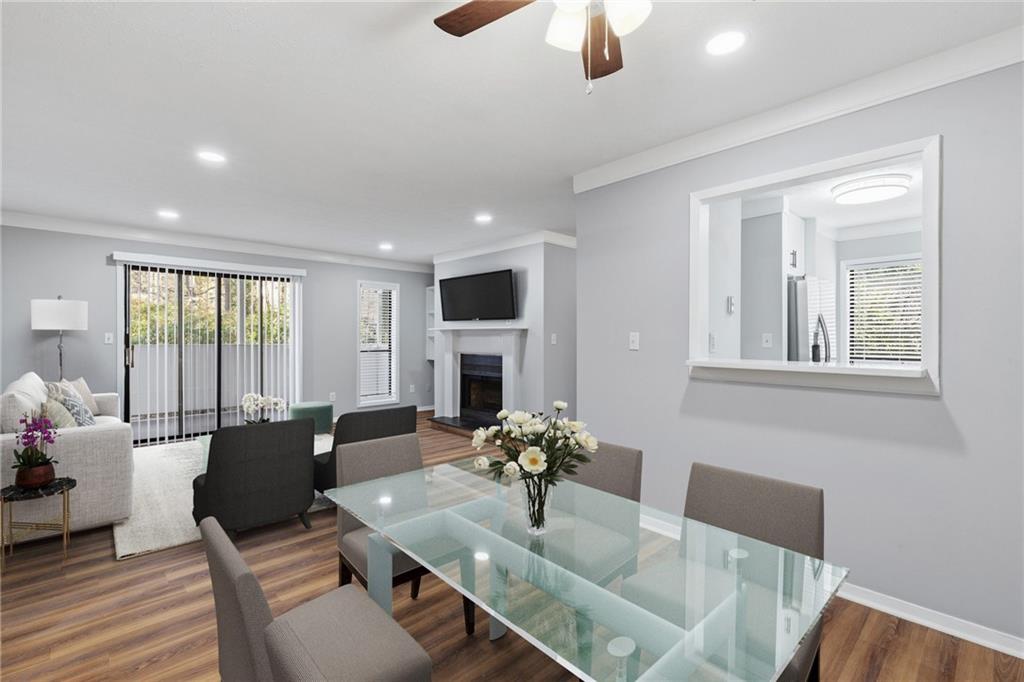 601 Wynnes Ridge Circle Southeast Marietta, GA 30067 - Photo 10 of 28 a living room with furniture fireplace and large windows