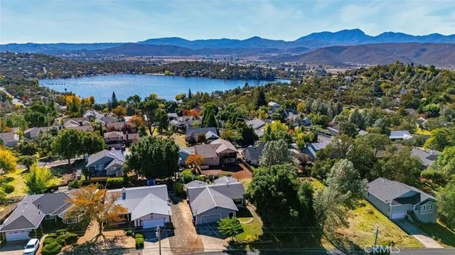 an aerial view of residential house with outdoor space and lake view
