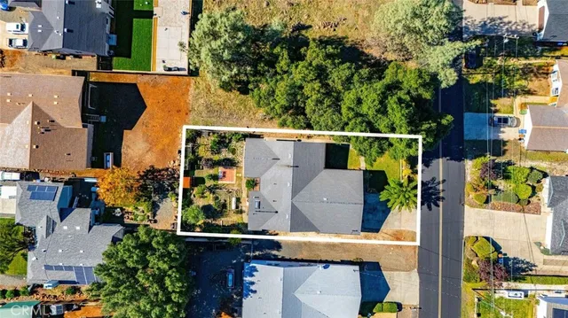 an aerial view of houses with outdoor space