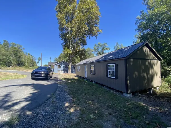 a view of backyard with a garden and entertaining space