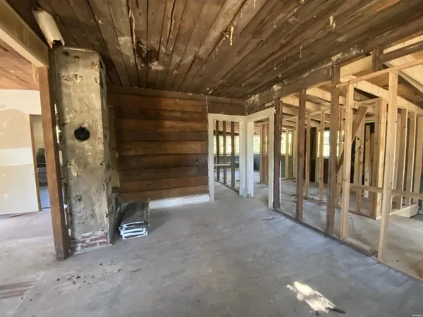 a view of an empty room with glass door