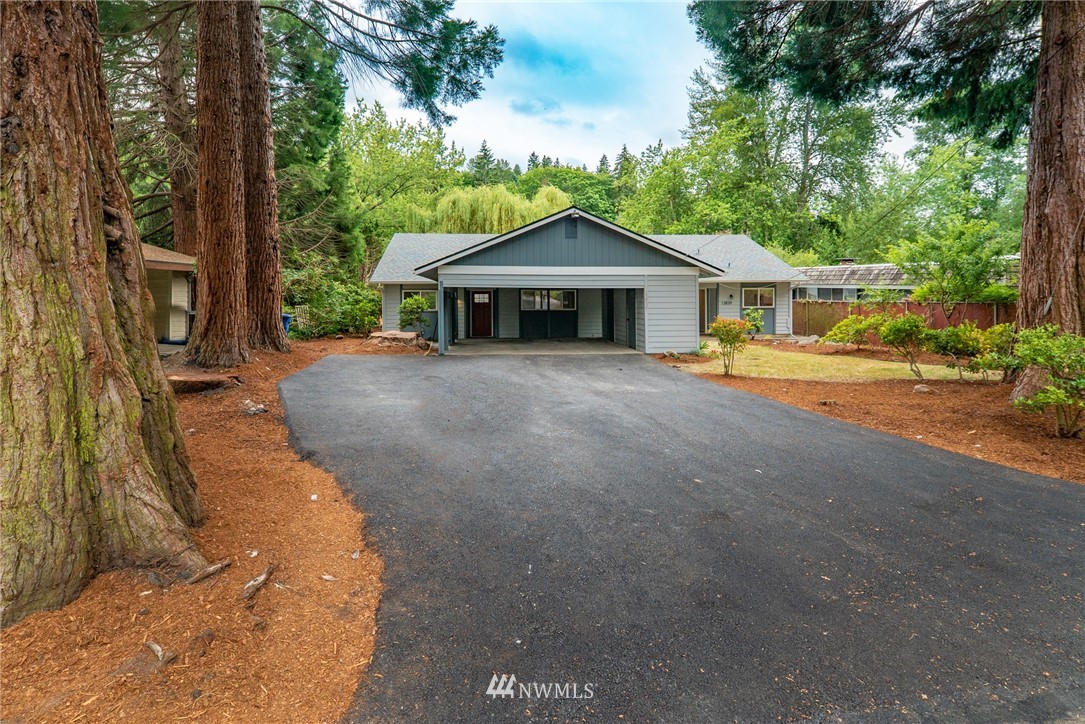 13839-13841 Southeast Allen Rd. Bellevue, WA 98006 - Photo 2 of 25 a view of a house with a tree in front of it