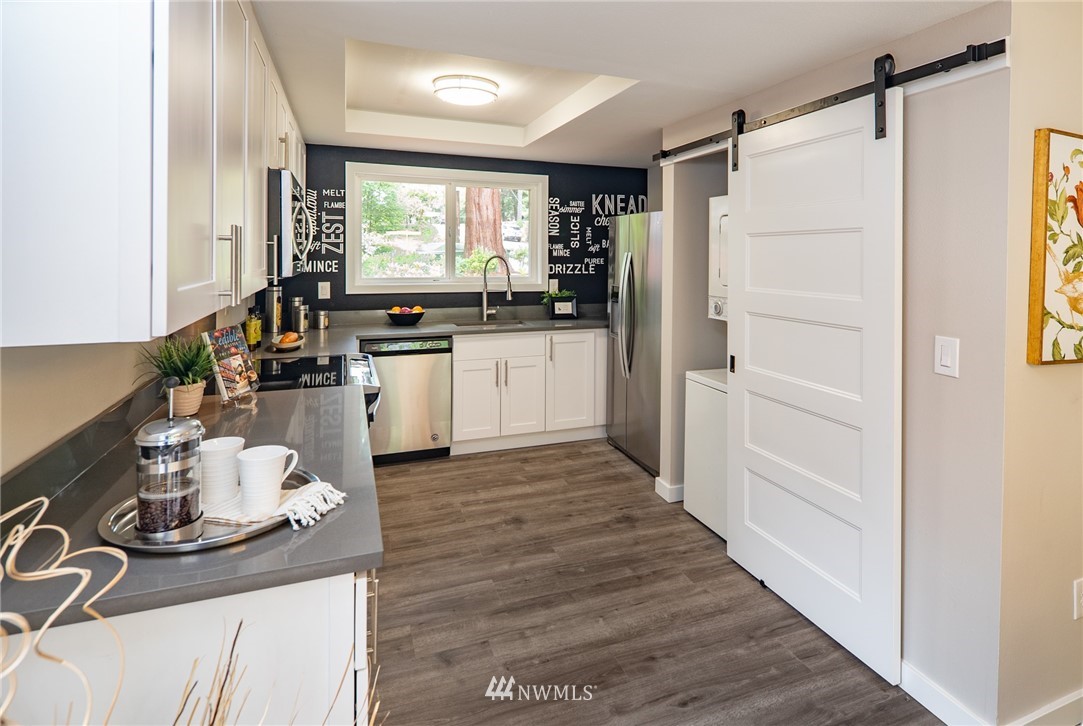 13839-13841 Southeast Allen Rd. Bellevue, WA 98006 - Photo 13 of 25 a kitchen with sink refrigerator and window