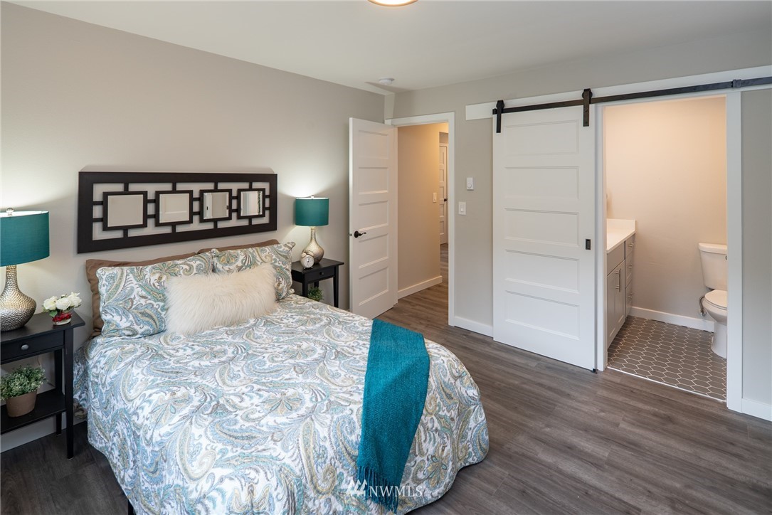 13839-13841 Southeast Allen Rd. Bellevue, WA 98006 - Photo 15 of 25 a bedroom with a bed and a walk in closet