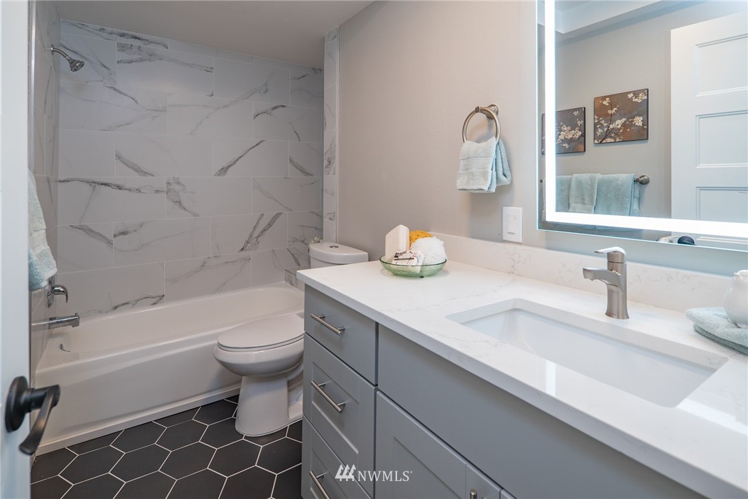 13839-13841 Southeast Allen Rd. Bellevue, WA 98006 - Photo 18 of 25 a bathroom with a sink a toilet and a bathtub