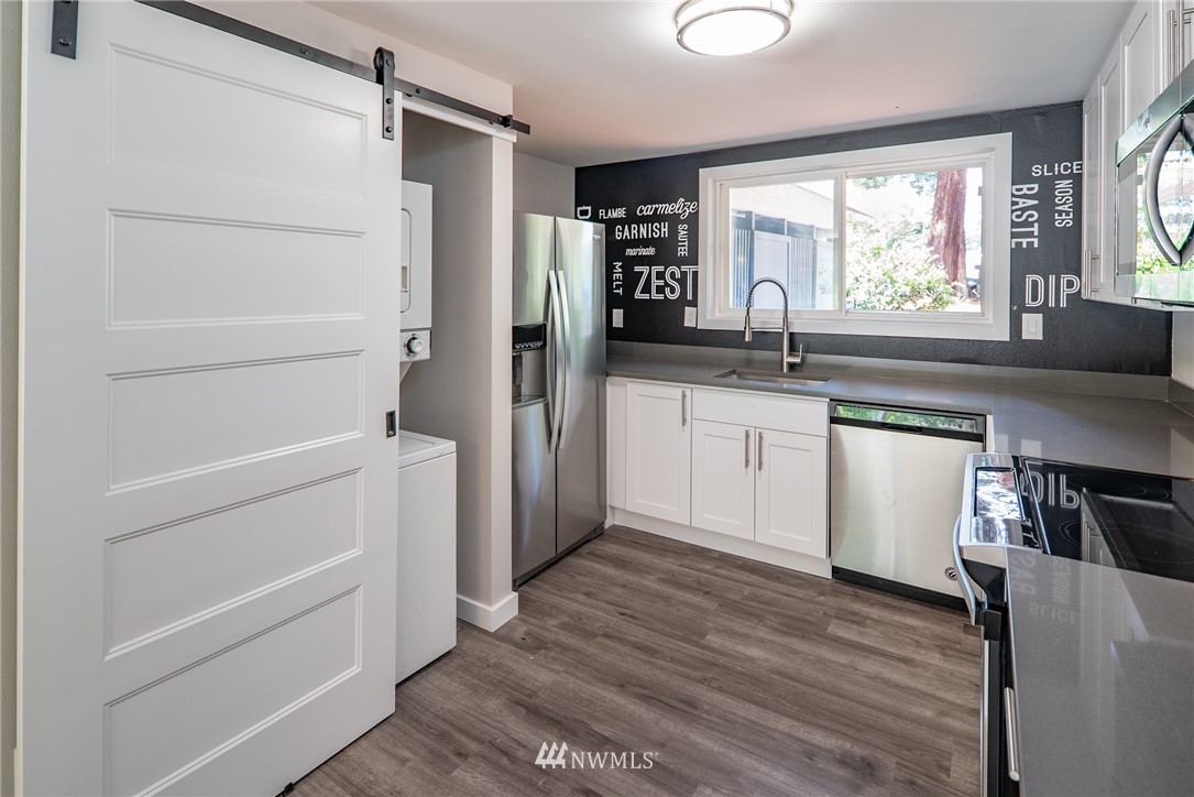 13839-13841 Southeast Allen Rd. Bellevue, WA 98006 - Photo 19 of 25 a kitchen with a refrigerator and a sink