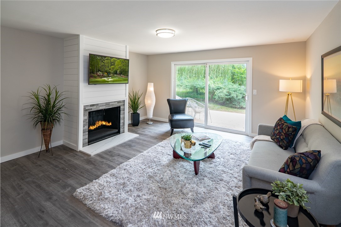 13839-13841 Southeast Allen Rd. Bellevue, WA 98006 - Photo 5 of 25 a living room with furniture and a fireplace