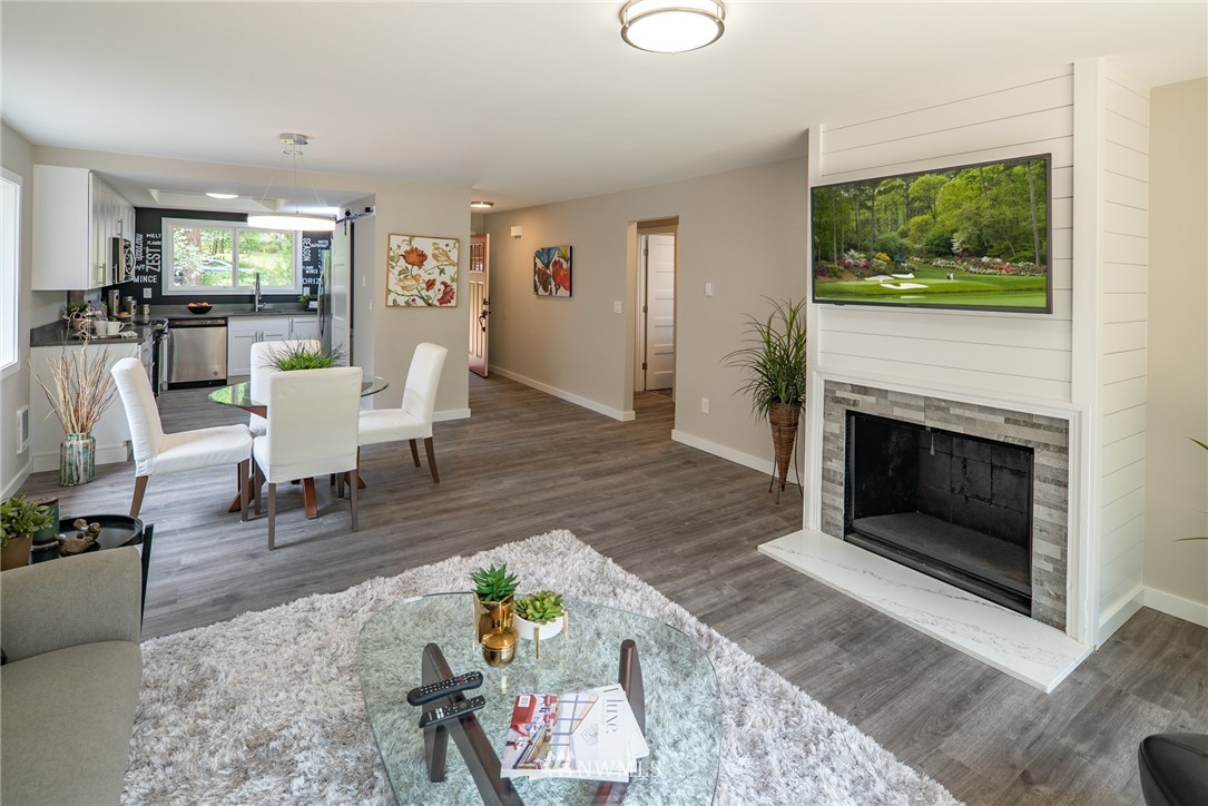 13839-13841 Southeast Allen Rd. Bellevue, WA 98006 - Photo 7 of 25 a living room with furniture and a fireplace