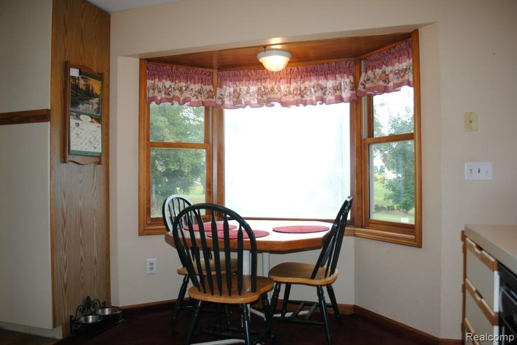 8707 West Van Buren Road Fowlerville, MI 48836 - Photo 5 of 22 Breakfast nook looking into beautiful spacious backyard.