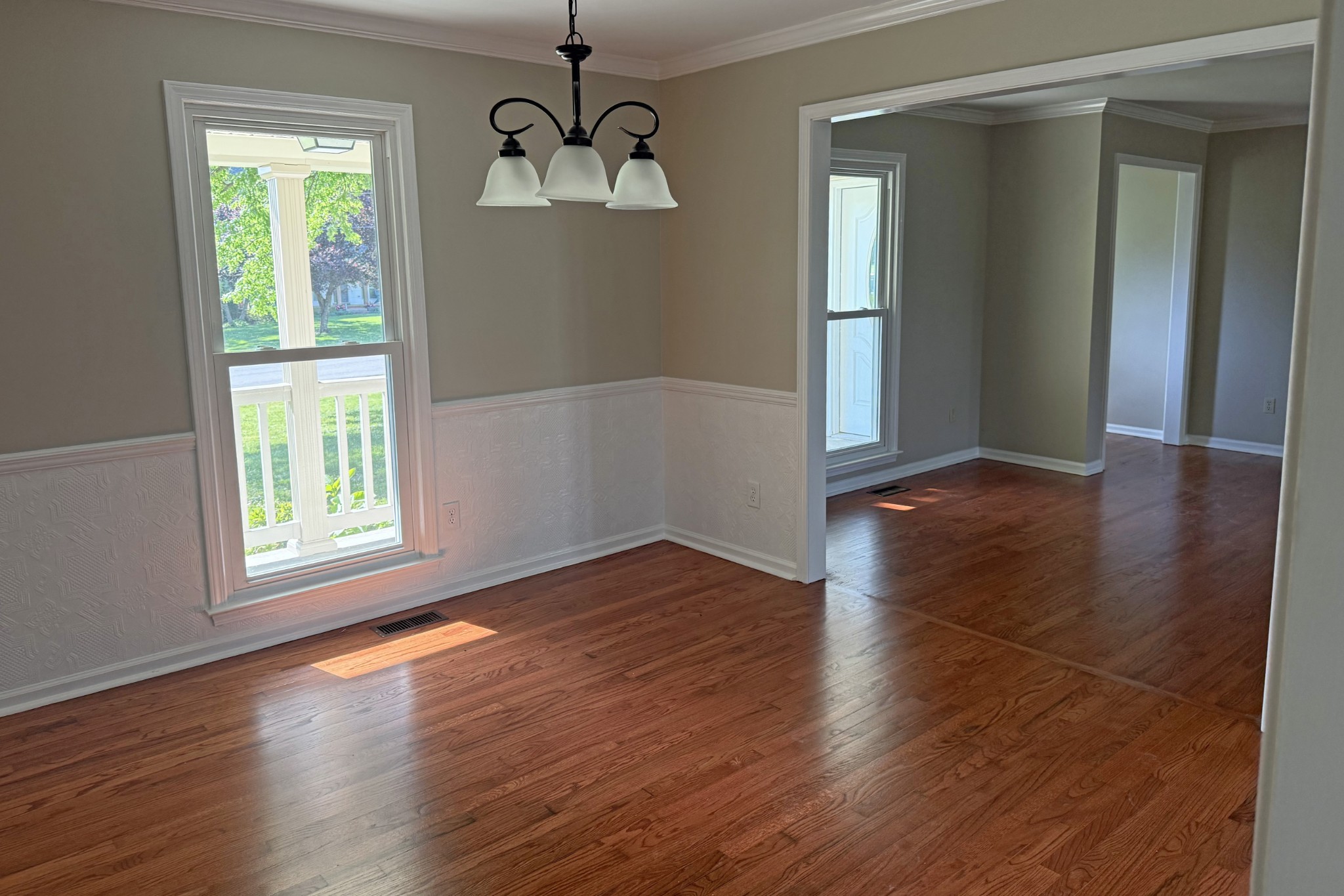 206 Stephens Hill Road Franklin, KY 42134 - Photo 3 of 21 an empty room with wooden floor chandelier and windows