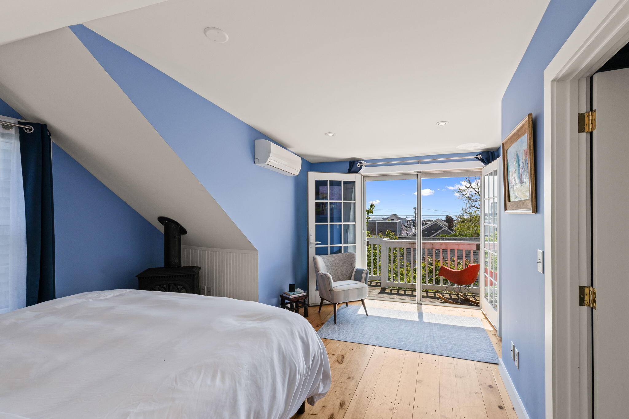 342 B Commercial Street Provincetown, MA 02657 - Photo 26 of 42 a bedroom with a bed and a large window with outer view