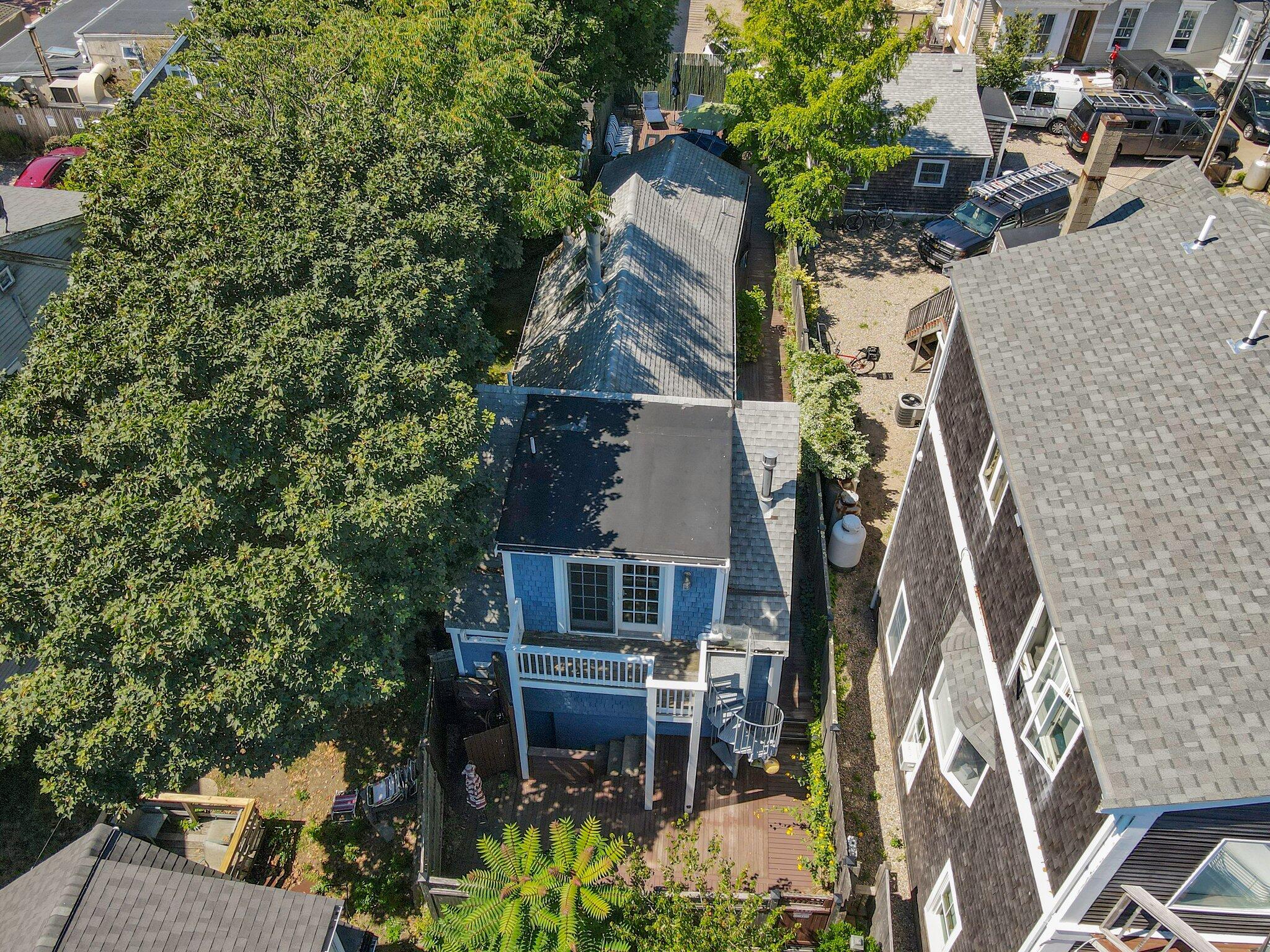 342 B Commercial Street Provincetown, MA 02657 - Photo 37 of 42 an aerial view of a house with a yard and potted plants