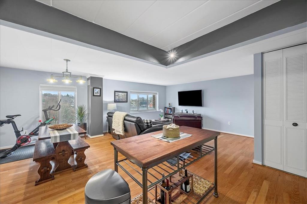 5 Bayard Road, Unit 617 Pittsburgh, PA 15213 - Photo 5 of 15 a living room with furniture a flat screen tv and a table